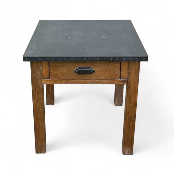 Reperch brand wooden end table with black top and drawer, studded edges, against a white background.