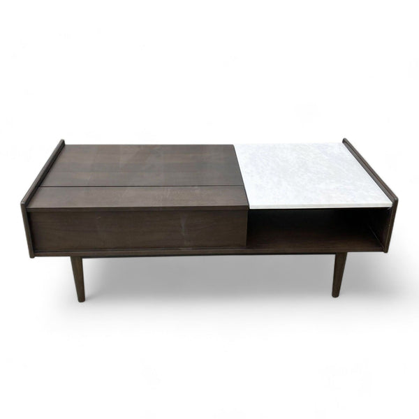 West Elm coffee table combining marble with walnut wood, clean angles, and open shelf.
