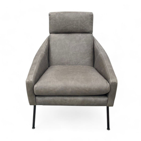 1. West Elm Austin lounge chair with cushioned back, leather upholstery, sloped arms, and metal legs, isolated on white background.