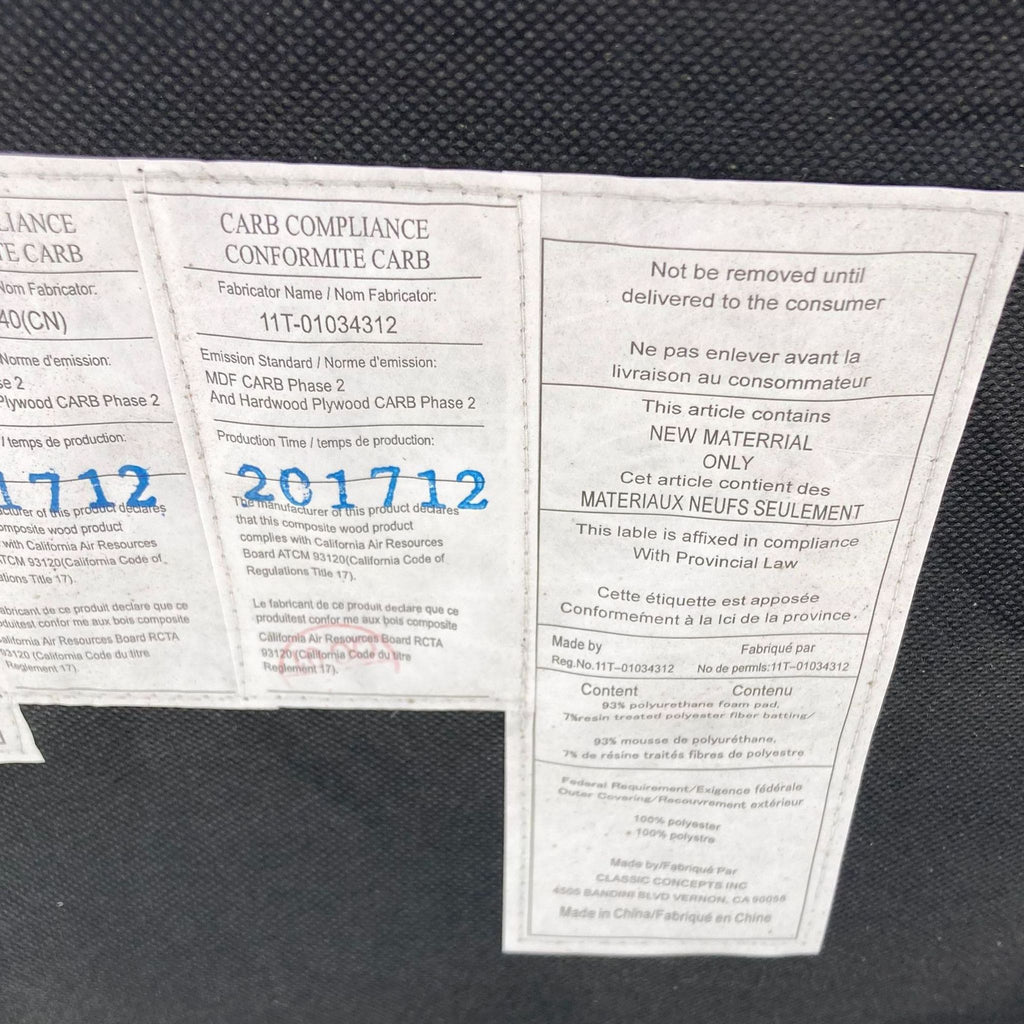 3. Compliance tags on a Reperch wingback chair indicating material, emission standards, and production information.