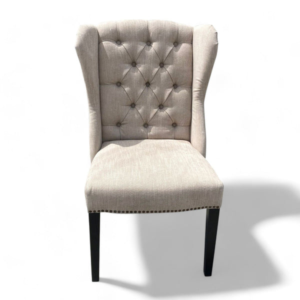 1. Elegant Reperch wingback chair with tufted backrest and nailhead trim, upholstered in neutral fabric, isolated on white.