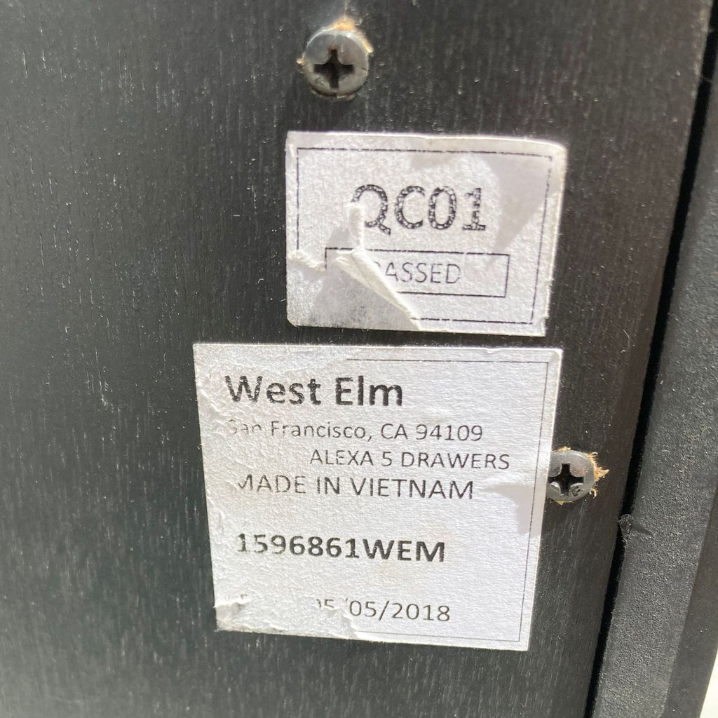 3. Manufacturer's label on a West Elm dresser indicating the 'ALEXA 5 DRAWERS' model and production details.