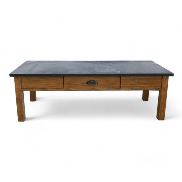 Reperch brand coffee table with dark slate top and a single drawer, wooden legs, against a white background.