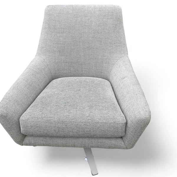 Gray West Elm lounge chair isolated on white background.
