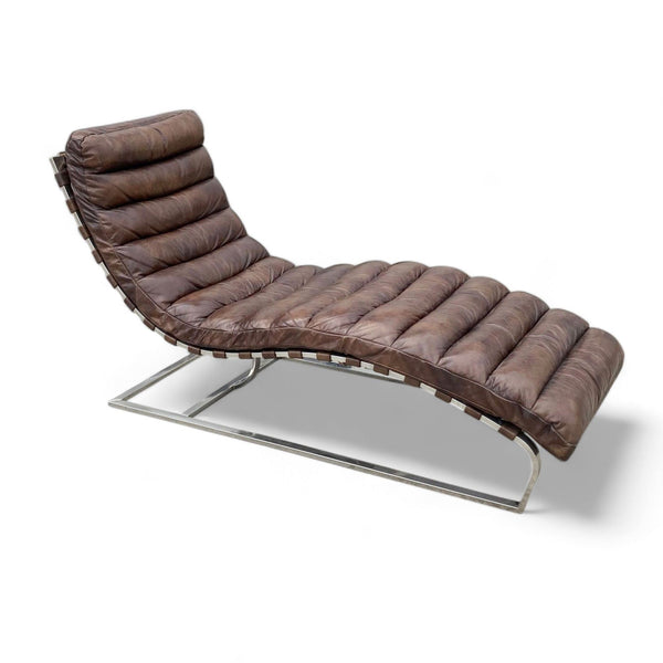 Restoration Hardware's Oviedo chaise with leather strap suspension and stainless steel base, upholstered in tufted leather.
