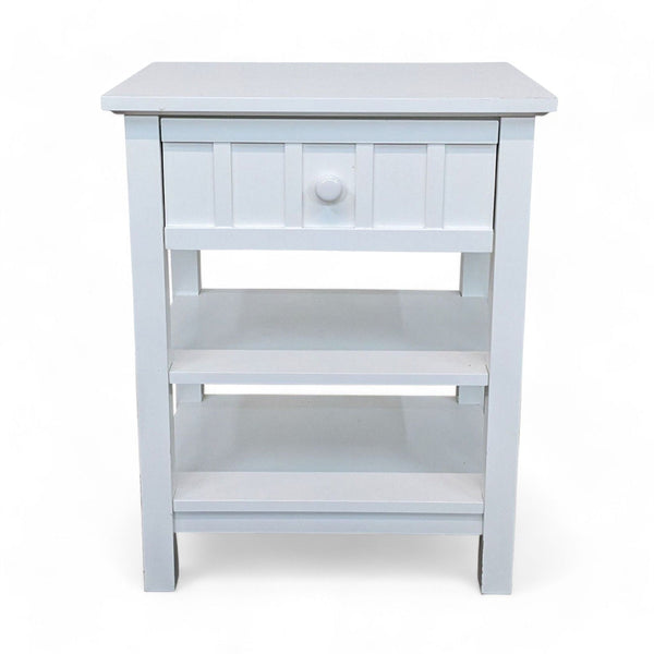 1. A light blue Crate & Barrel end table with a drawer and two lower shelves on a white background.