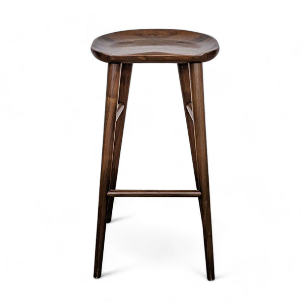 1. Rejuvenation-brand bar stool with a round walnut seat and slender, angular legs against a white background.
