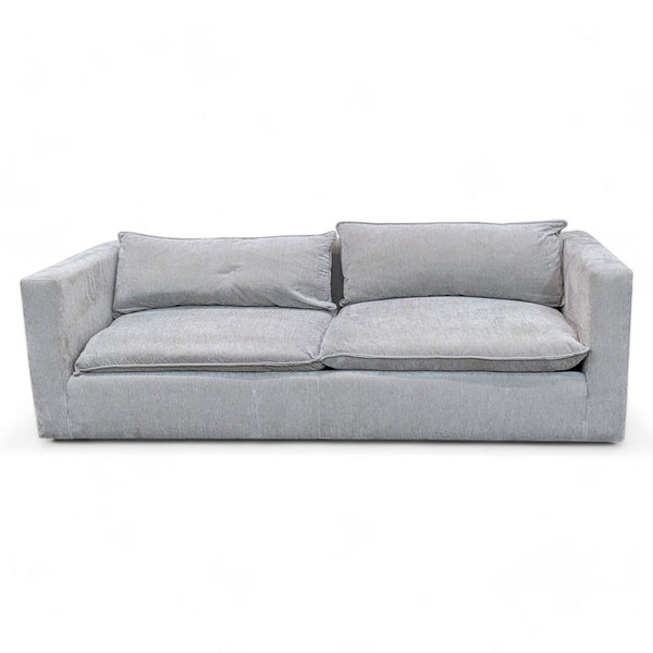 1. Dove grey Lotus low sofa with plush down blend pillows and flange detailing, 3-seat design by Crate & Barrel.