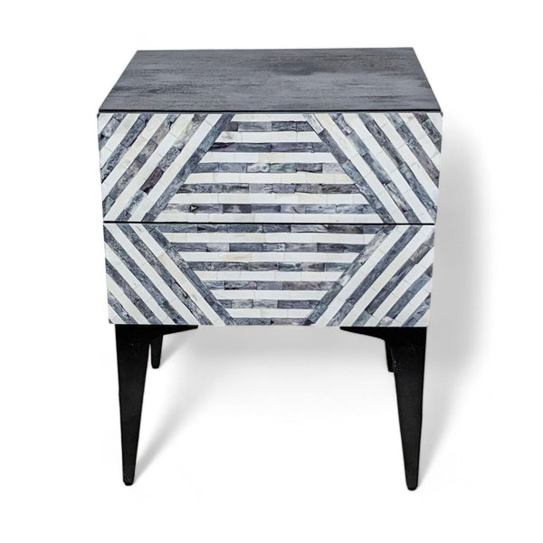 1. West Elm end table with a dark surface and angled striped pattern on drawers, set against a white background.