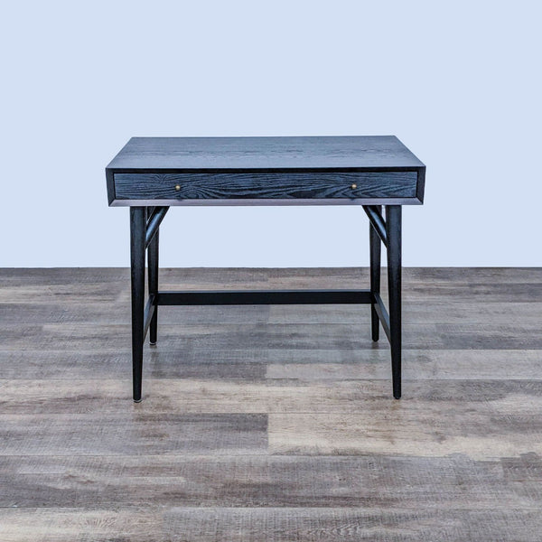 Compact black West Elm writing desk, 36 inches, with a single drawer and metal pulls, on a wooden floor.