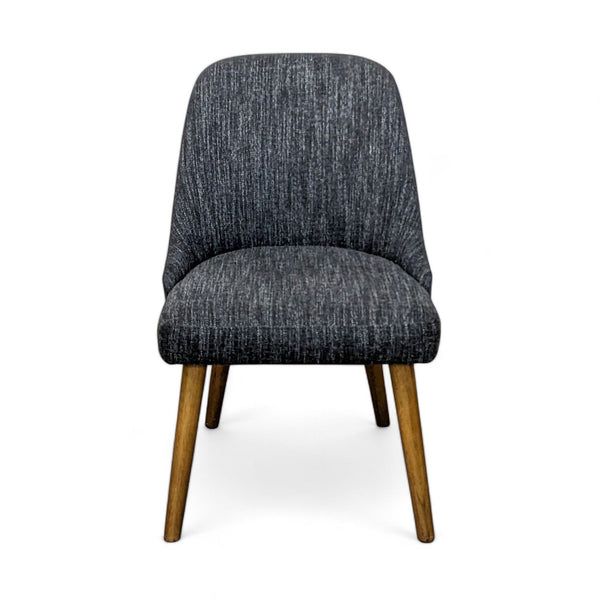 West Elm Mid-Century Dining Chair with comfy wide seat and sloping back on tapered wood legs, front view on white background.