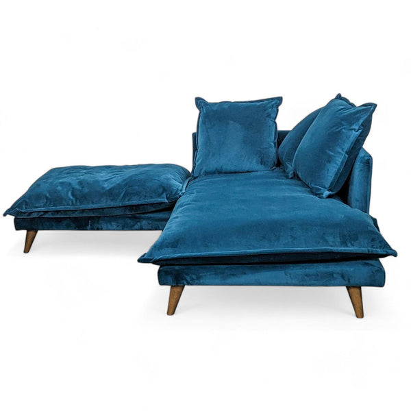 Peacock velvet Denna single-armed chaise lounge with ottoman by Joybird Furniture, showcasing plush cushions and tapered wooden legs.