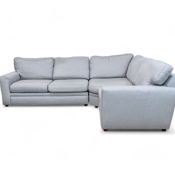 1. "Pottery Barn Pearce sectional in ash performance Sunbrella fabric with T-back cushions and square arms."