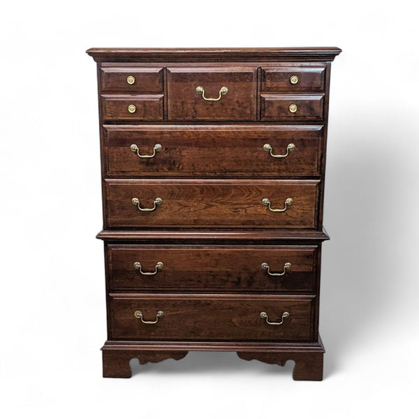 1. Vintage Pennsylvania House wooden chest of drawers with five drawers and brass handles, isolated on a white background.