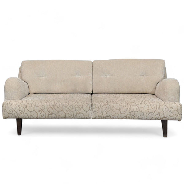 Beige Reperch sofa with patterned seat cushion, solid frame, saddle arms, and dark wood legs.