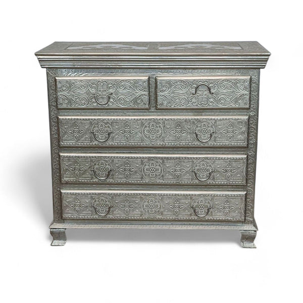 Embossed Reperch 5-drawer dresser with metallic patterns and antique handles in a classic design.