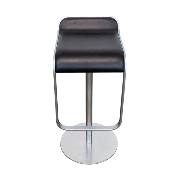 1. DWR's modern black leather adjustable stool with sleek metal base against a white background.
