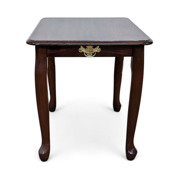 Reperch end table with a decorative brass pull on a faux drawer front, dark wood finish, and curved legs on a white background.
