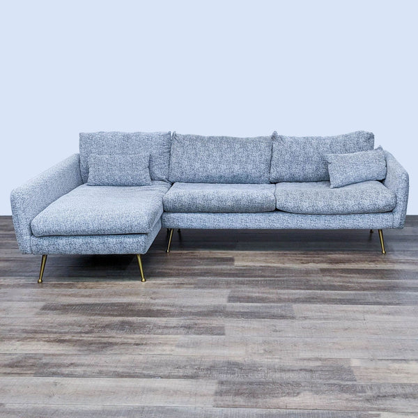 1. "Albany Park sectional sofa with chaise, featuring grey upholstery and brass legs, displayed in a room with wooden flooring."