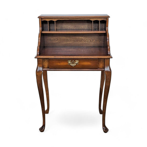 Ethan Allen wooden secretary desk with drawers open, showcasing compartments and a brass pull.