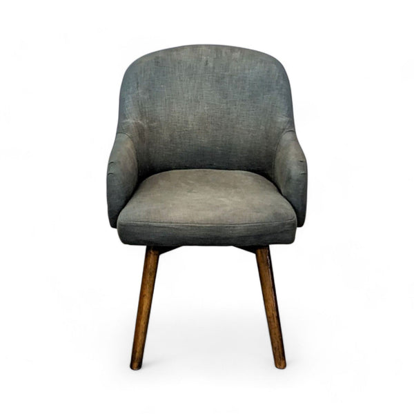 1. West Elm Wayne Grey counter stool with a rounded back and padded seat, showcasing a walnut wood frame.