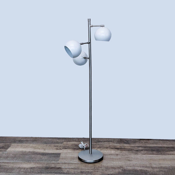 Reperch brand floor lamp with two adjustable white glass globes on a metal stand, against a neutral background.
