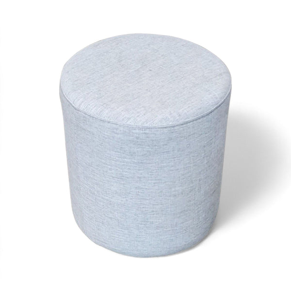 1. "Round light blue fabric ottoman by Article on a white background."