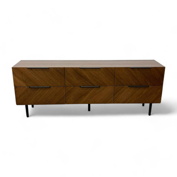 1. "Nera walnut low dresser by Article with a Mid Century Modern style, six drawers, and solid wood legs."