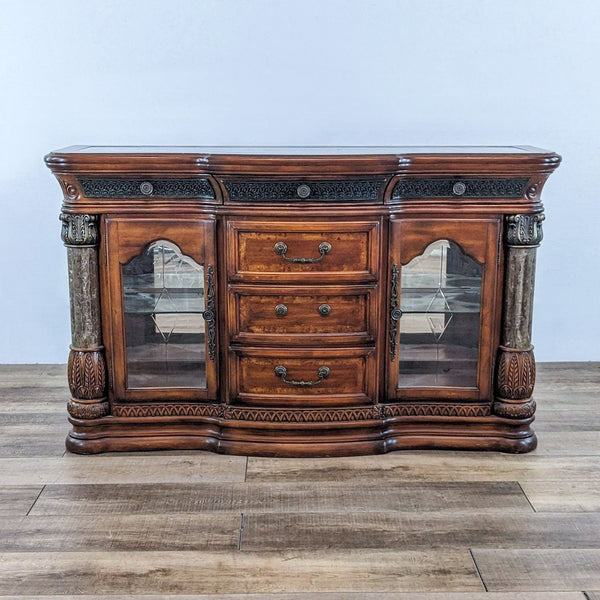 1. Traditional Reperch sideboard with beveled glass doors, mirrored back, and detailed wood carvings.