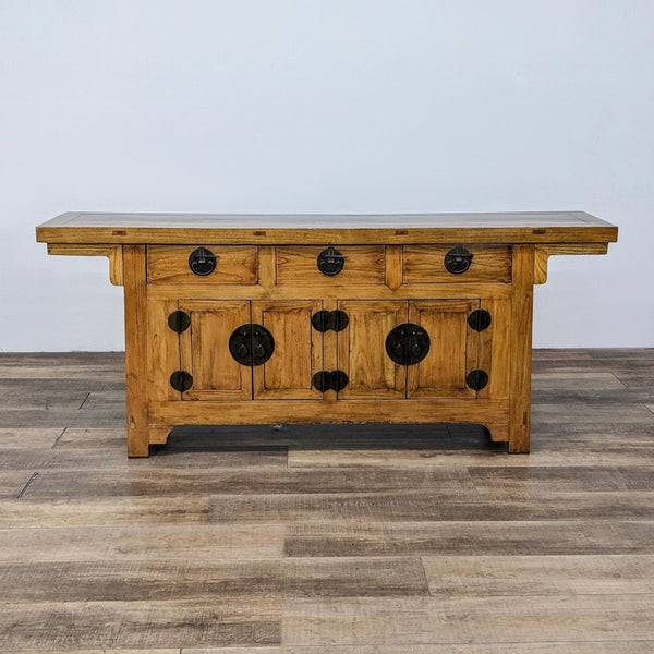First image: Wooden sideboard with iron hardware by GaulSearson Ltd, featuring multiple drawers with round black handles.