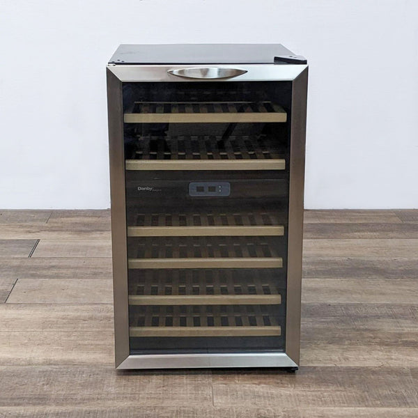 1. A Danby wine cooler with closed glass door, showcasing multiple wooden shelves inside, set against a plain background.