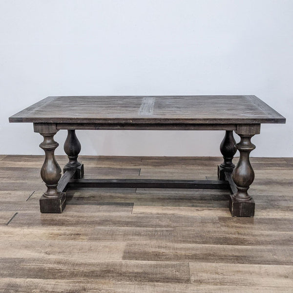 Restoration Hardware 17th C. Priory rectangular dining table with solid acacia wood and baluster-shaped trestle legs.