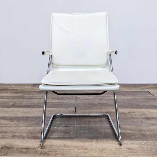 Zuo Modern white leather chair with chrome frame, frontal view on wooden floor.