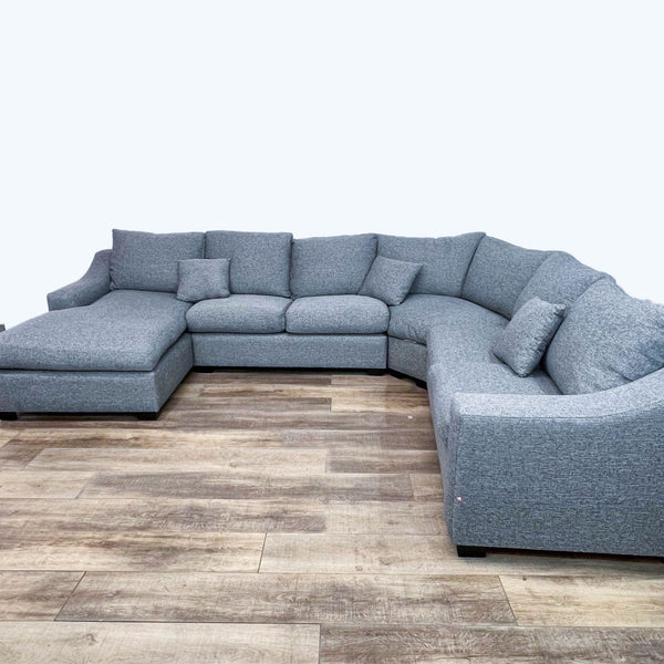 Contemporary 147" Reperch four-piece sectional sofa in gray with dark finish feet, on a wooden floor.