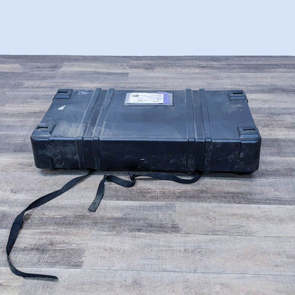 A rolling hard case by Mod Displays for transporting a portable cabinet designed for events, shown on a wood floor.