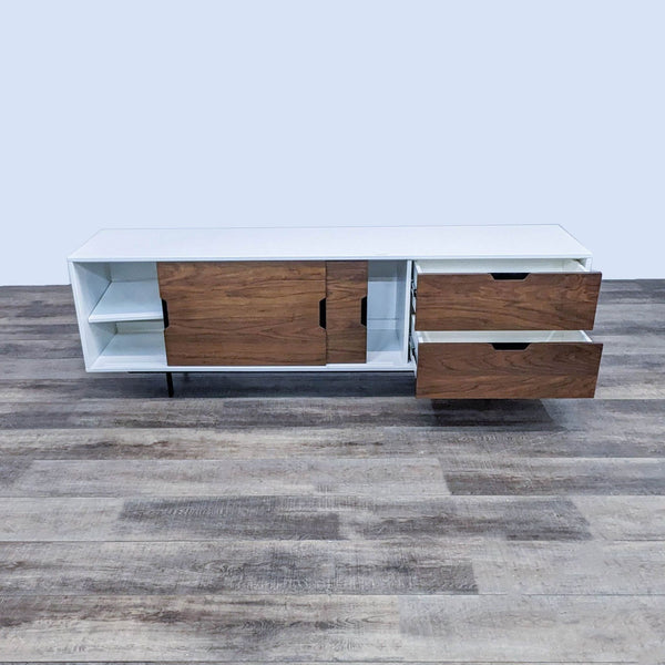 Alt text 1: Four Hands white high-gloss lacquered entertainment center with brown walnut accents, featuring open shelving and drawers, on a wooden floor.