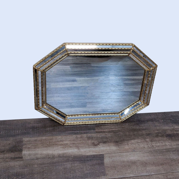 La Barge Hollywood Regency style octagonal mirror featuring a wood faux bamboo frame with three rows of recessed mirrors.