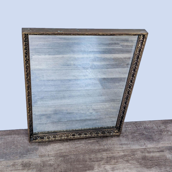 Reperch vintage mirror with ornate gold-finished wood frame on wooden surface.