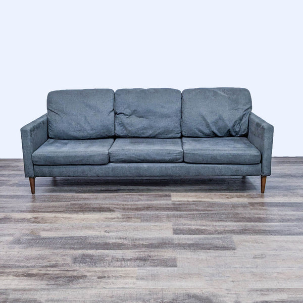 1. Reperch 3-seat gray sofa with a minimalist design, narrow arms, and tapered wooden legs, set against a plain background.