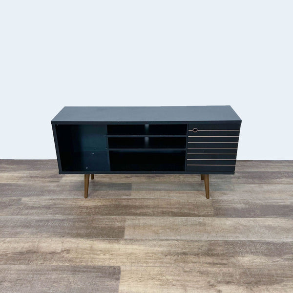 Reperch Entertainment Center, black with open shelf and striped cabinet door, angled view on wooden floor.