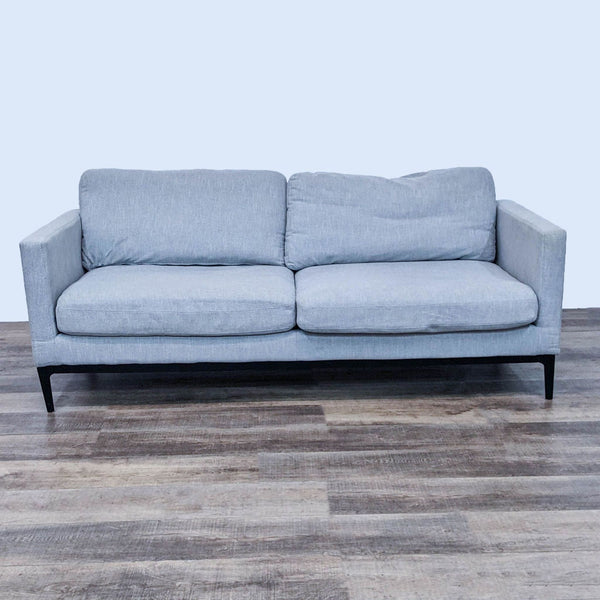 Alt text 1: Three-seat Coaster sofa with a clean line design, gray upholstery, narrow arms, and metal frame feet against a wooden floor.