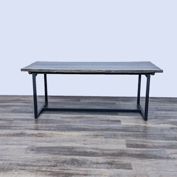 Zuo Era Industrial dining table with a cherry oak finish and uneven edges on a black metal base.