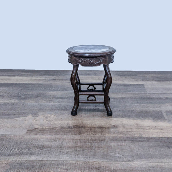 Alt text 1: Reperch brand side table with dark wood frame and marble top, set against a wooden floor background.