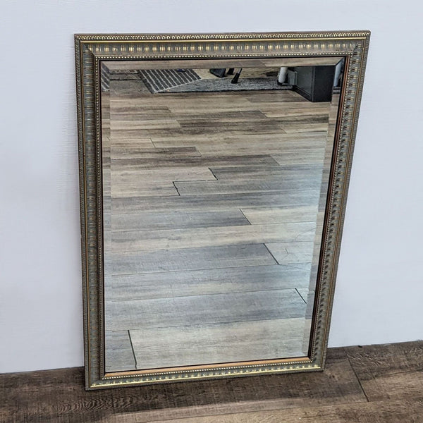 Reperch antique gold-framed wall mirror with beveled edges, classic style, against a wooden floor background.