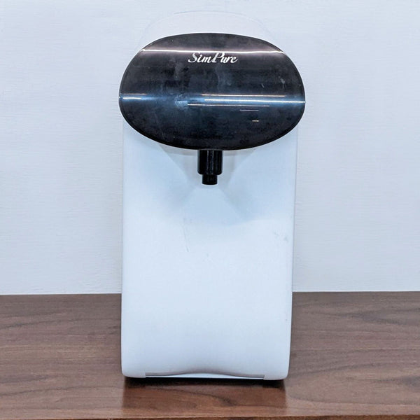 Alt text 1: White Simpure water dispenser with a black top, nozzle visible, on a wooden table against a plain background.