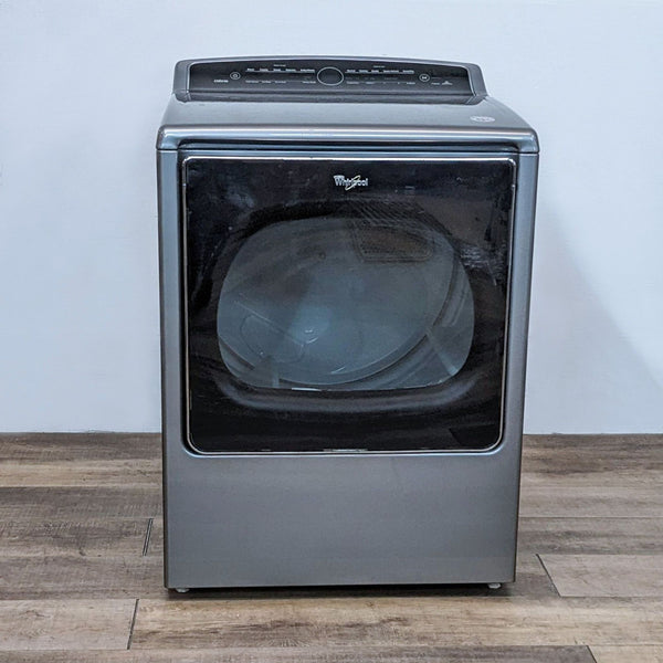 Front view of a Whirlpool washer/dryer with a black door and digital control panel on top.