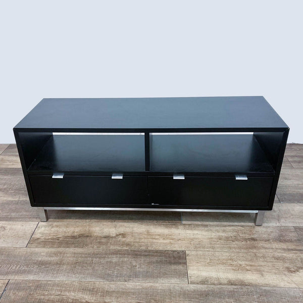 Reperch black entertainment center with chrome base and sleek hardware, featuring open shelving and drawers. 