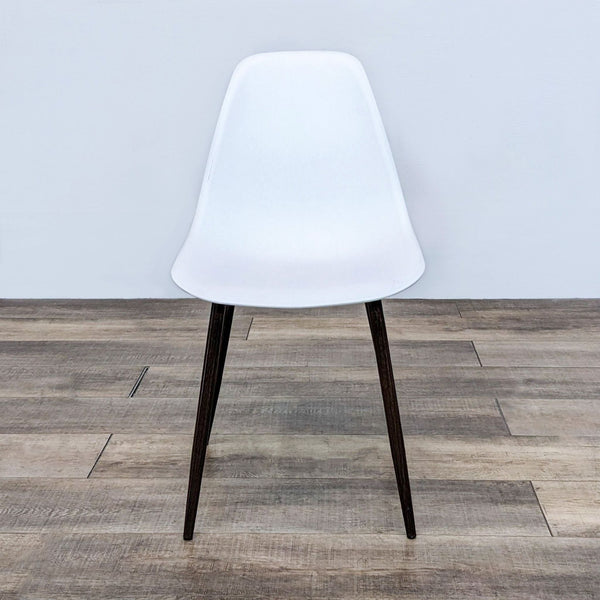 Alt text 1: White matte contemporary Reperch dining chair with mid-back and walnut finish metal legs.