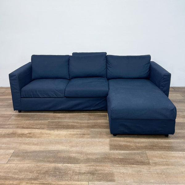 Ikea modern two-piece sectional with chaise in blue, showcasing clean lines and a minimalist design.