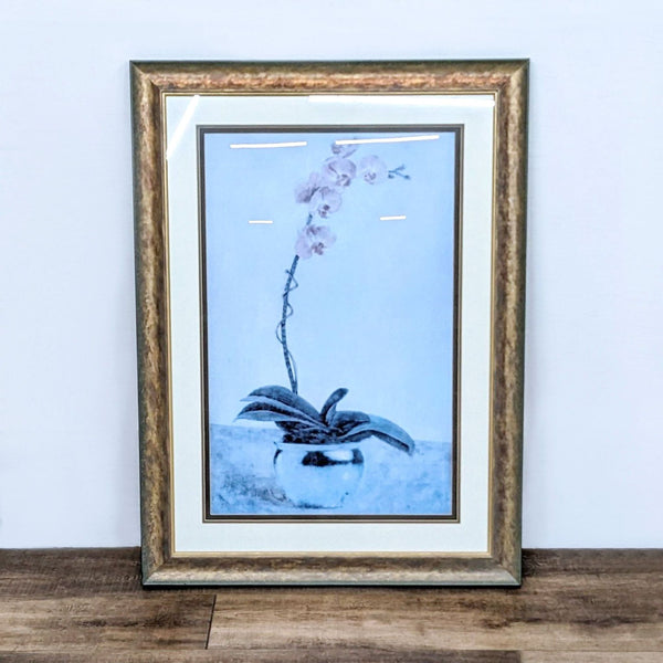 Reperch brand framed Giclee art print featuring an orchid in a planter on a wooden surface.